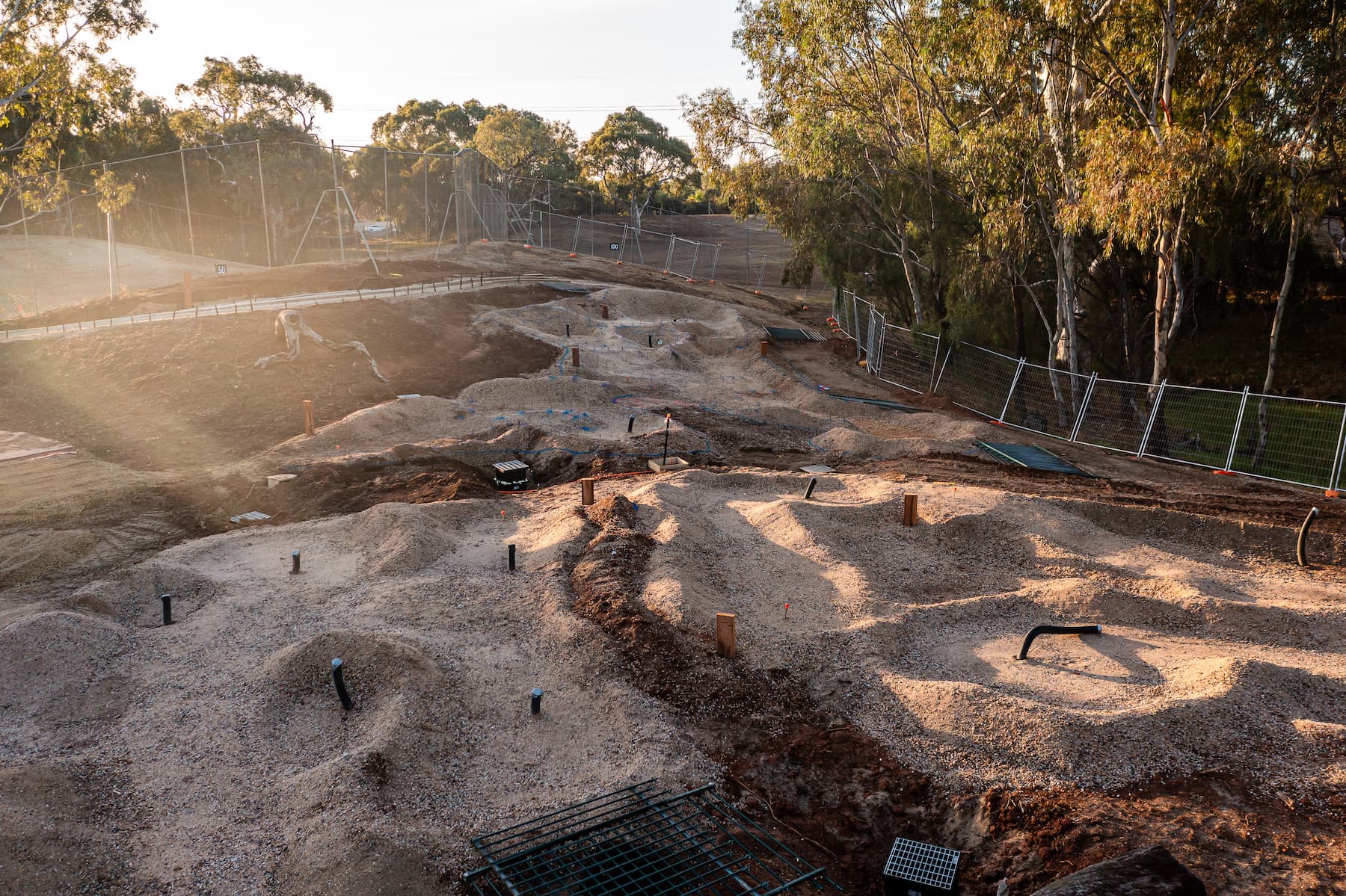 Angled construction photo, showing variable ground levels of Shanx mini golf course